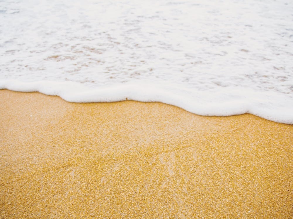 Foamy Waves On Beach
