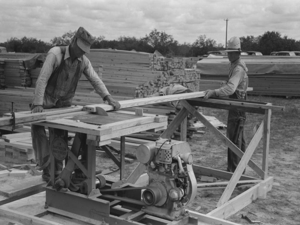 Untitled Photo, Possibly Related To Cutting Two By Fours Into Identical Lengths At Migrant Camp Under