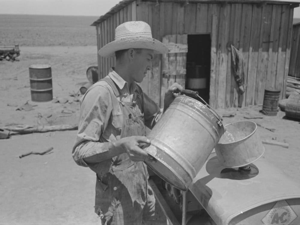 Untitled Photo, Possibly Related To Pouring Gasoline Into Tractor, Large Farm Near Ralls, Texas