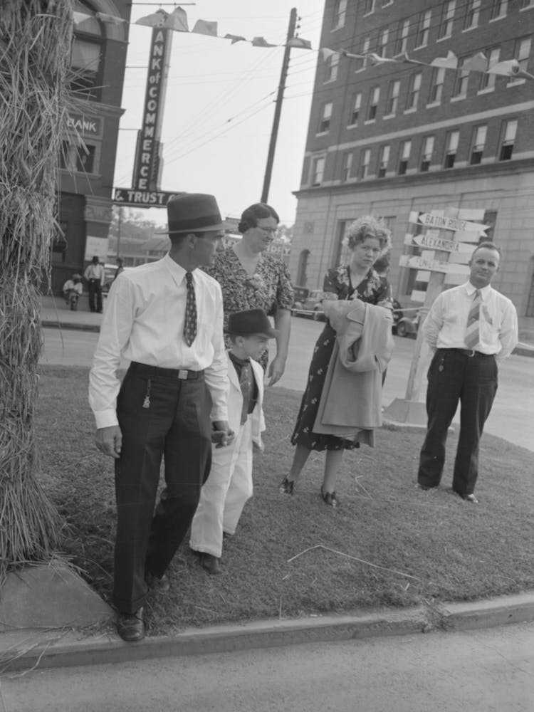Untitled Photo, Possibly Related To After The Parade Is Over People Follow The Line Of It, Walking Down The Middle Of The