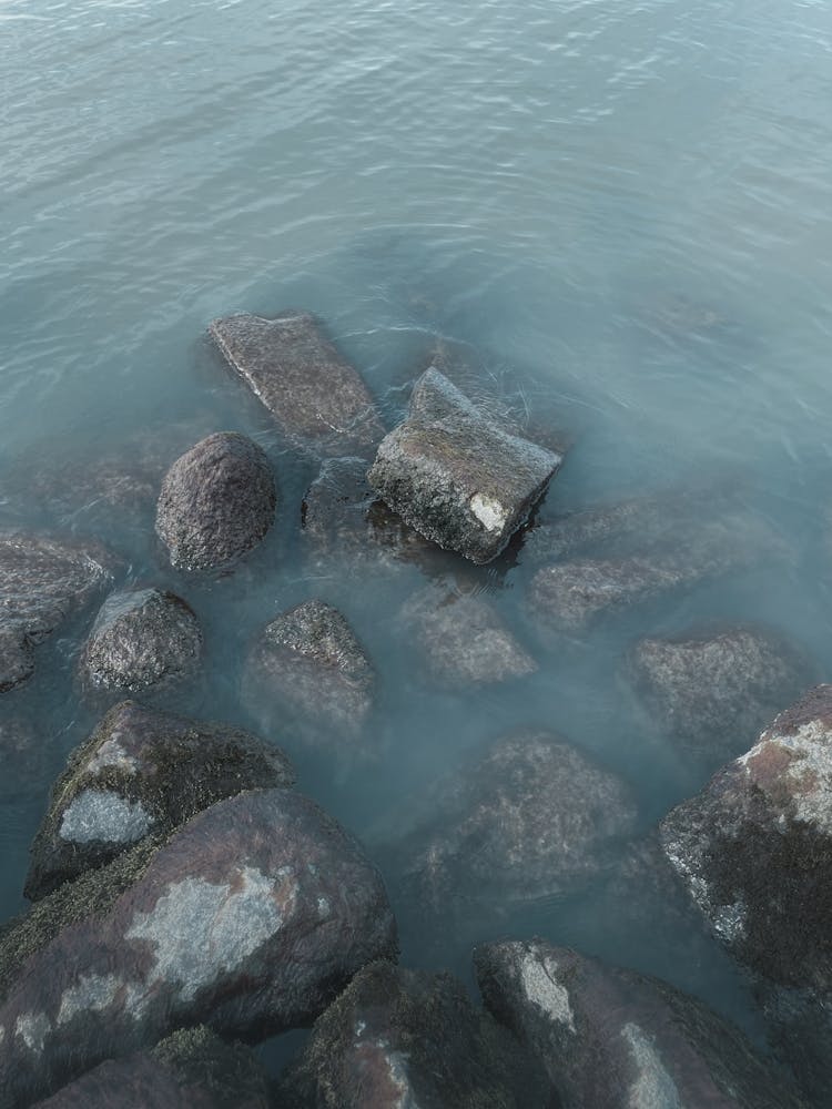 Ocean Shore, Rocks In Blue Water