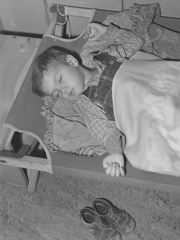 Child Of Farm Worker Takes A Nap At The Nursery School At The Fsa (Farm Security Administration) Farm Family