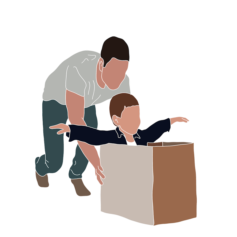 Man Lifting Child Out Of Box Father's Day