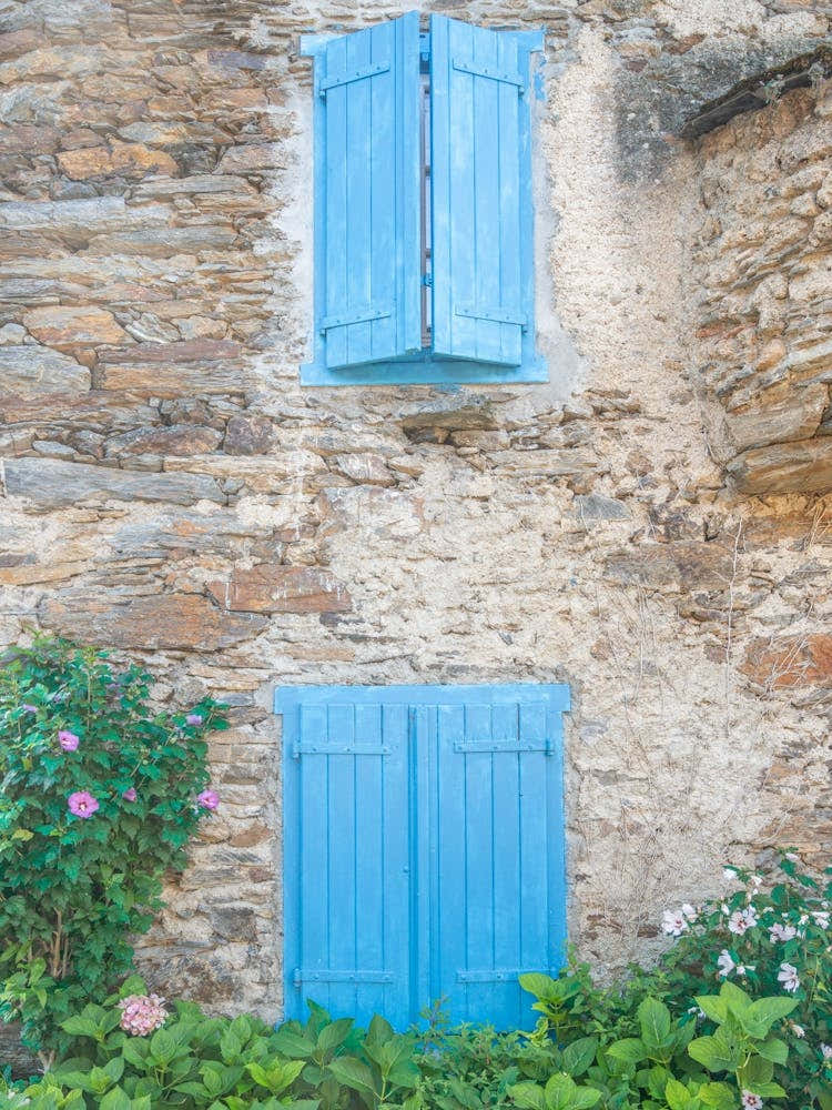 Vintage blue shutters in a village in the French pyrenees - street and travel photography by Christa Stroo Photography