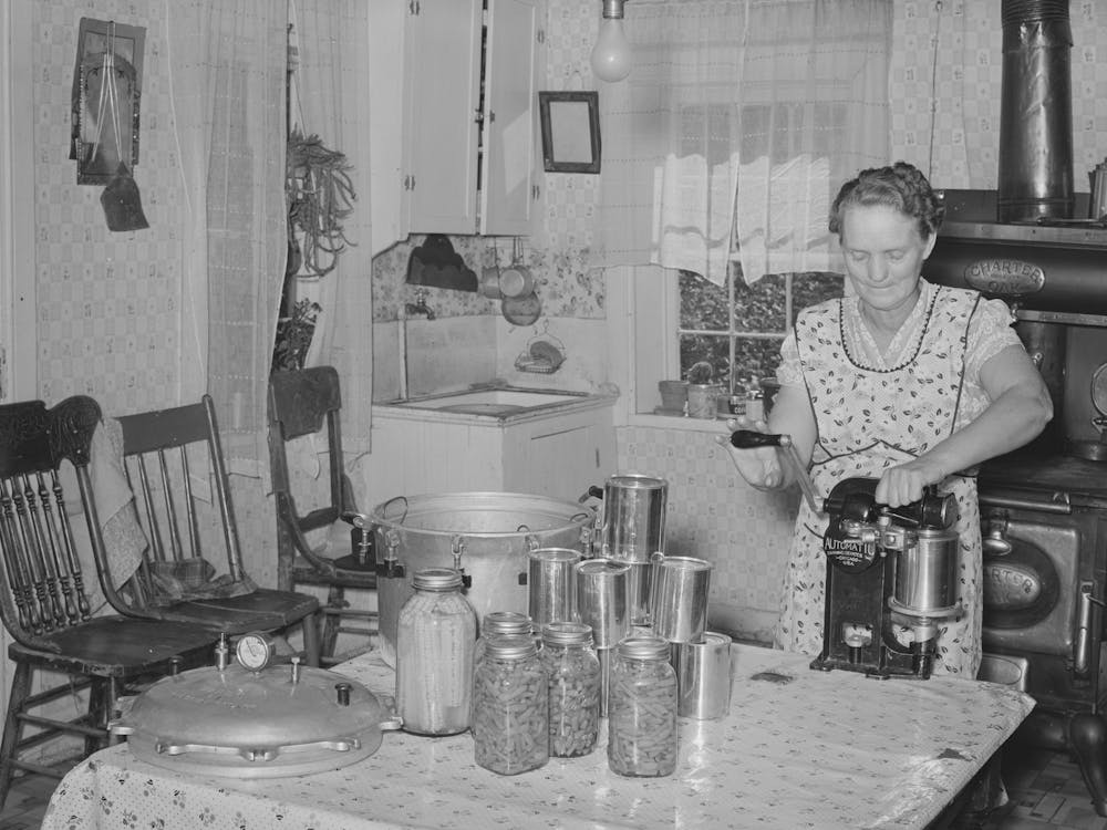 Mrs Christiansen Of The Christiansen Canning Unit Sealing Cans, During 1939 She Canned 2300 Quarts Which Included