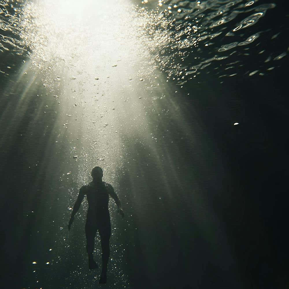 Portrait Of A Man Swimming Underwater