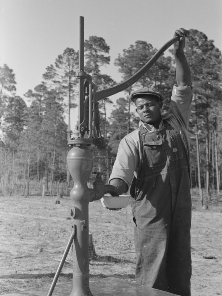 Untitled Photo, Possibly Related To Fsa (Farm Security Administration) Client Pumping Water From His Sanitary Well