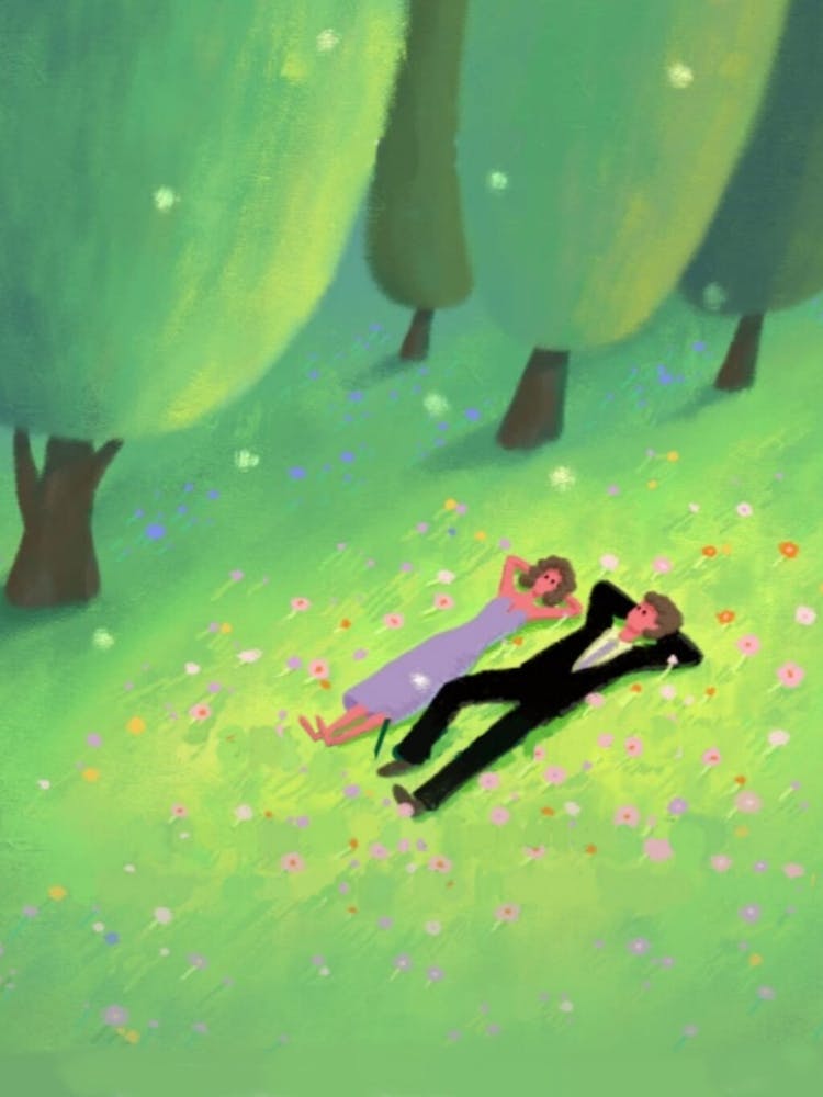 Couple Laying In The Grass