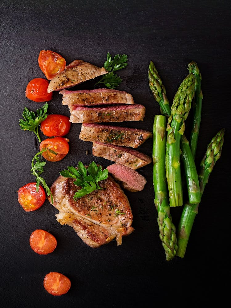 Juicy steak beef with spices, tomatoes, asparagus — Food kitchen poster/blackboard, photo art