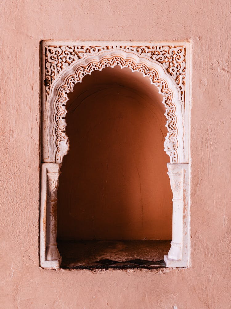 Pink window in the wall, Malaga, Spain