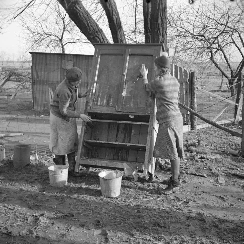 Women Cleaning Mud Off Furniture Damaged By Flood, Posey County, Indiana By Russell Lee