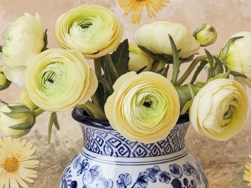 Yellow Daisies In A Blue Vase