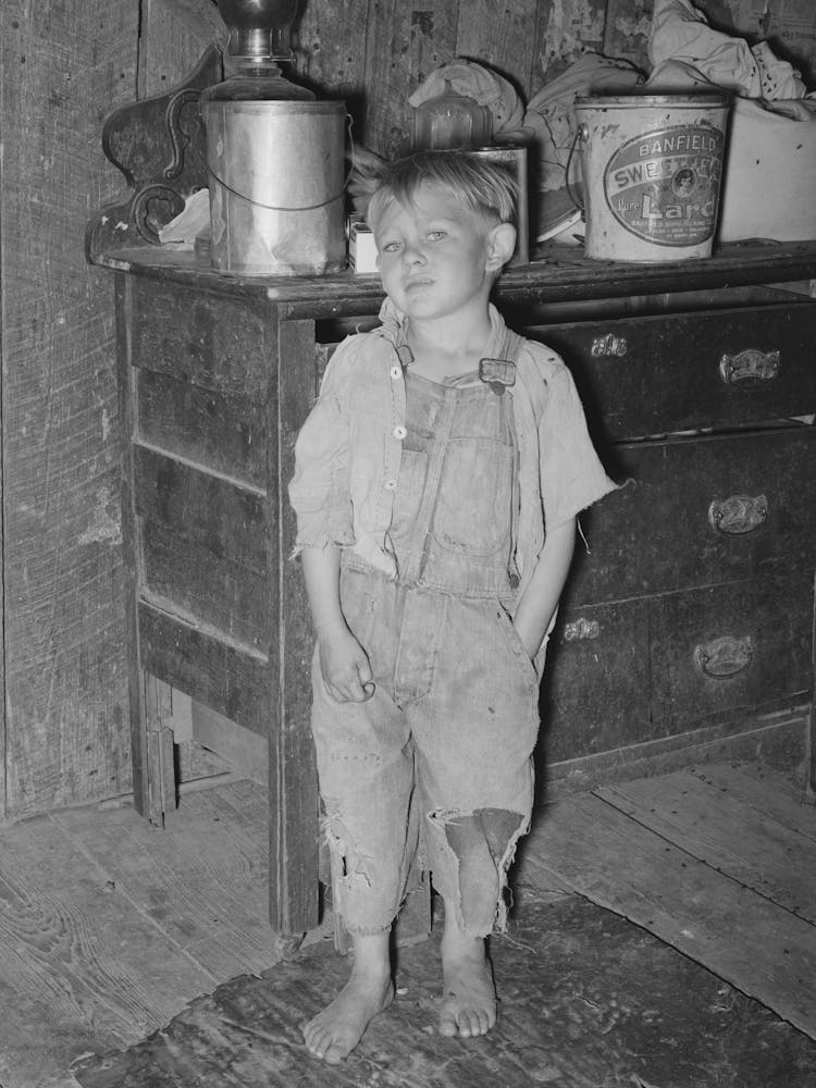 Child Of White Tenant Farmer In Kitchen Of His Home, Mcintosh County, Oklahoma, Notice The Pail Of Lard By Russell Lee