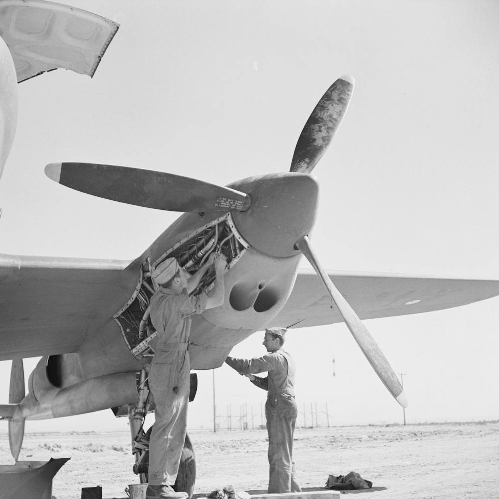 Working In The Motor Of An Interceptor Plane, Lake Muroc, California By Russell Lee