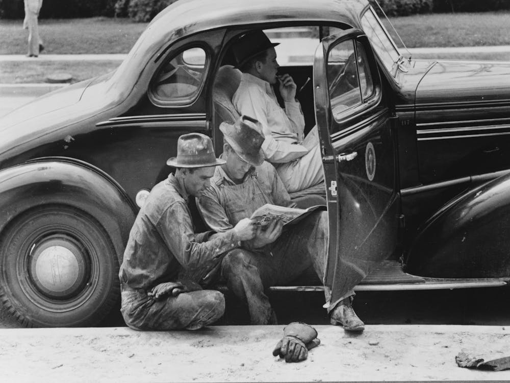 Oil Field Workers Taking Timeout To Read The Paper, Oil Well, Kilgore, Texas By Russell Lee