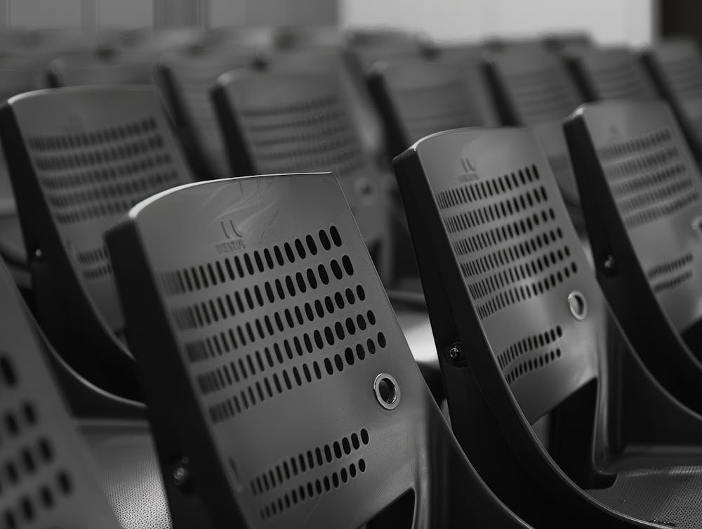 Black And White Image Of Rows Of Chairs