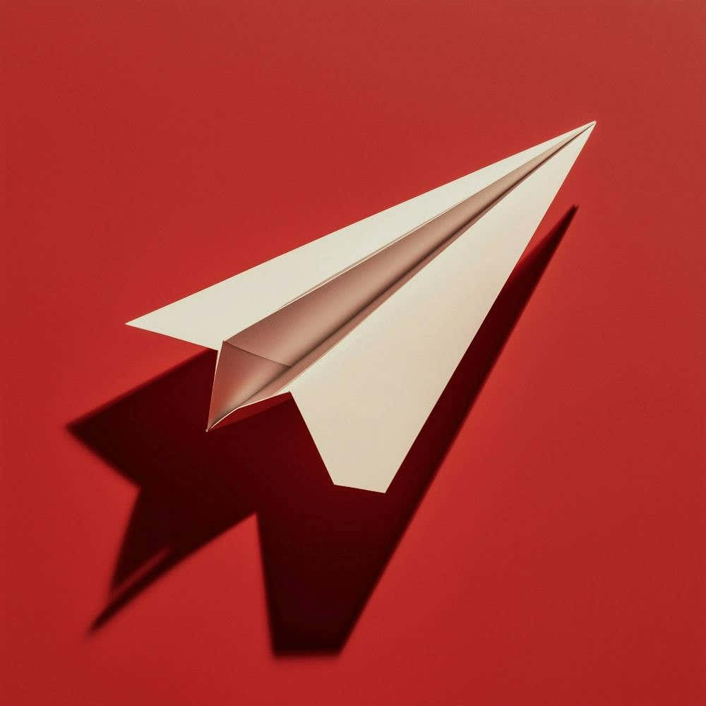 Paper Airplane On Red Background