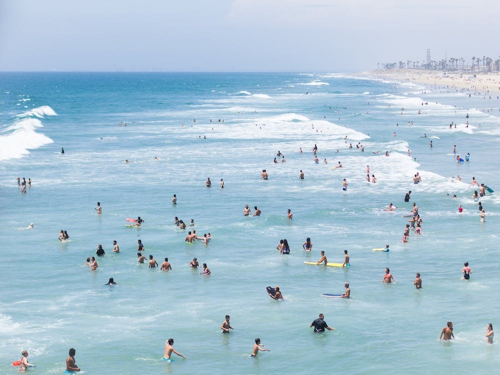 People Swimming In The Ocean, Praia Huntington, California