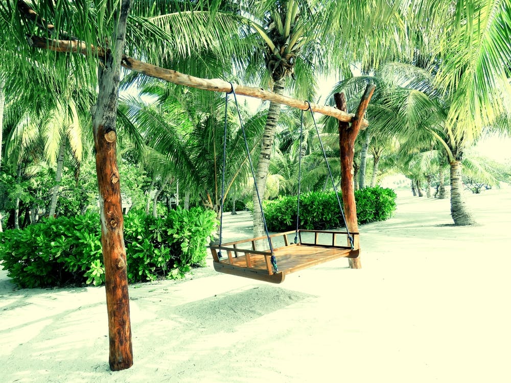 Maldives Swinging Bench on Tropical Beach