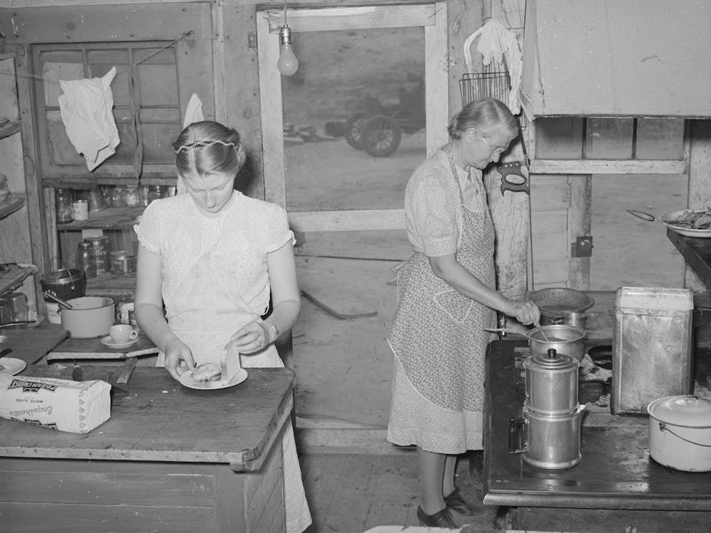 Mother And Daughter Working In The Kitchen Of The Cafe At Pie Town, New Mexico, The Daughter With Her Husban