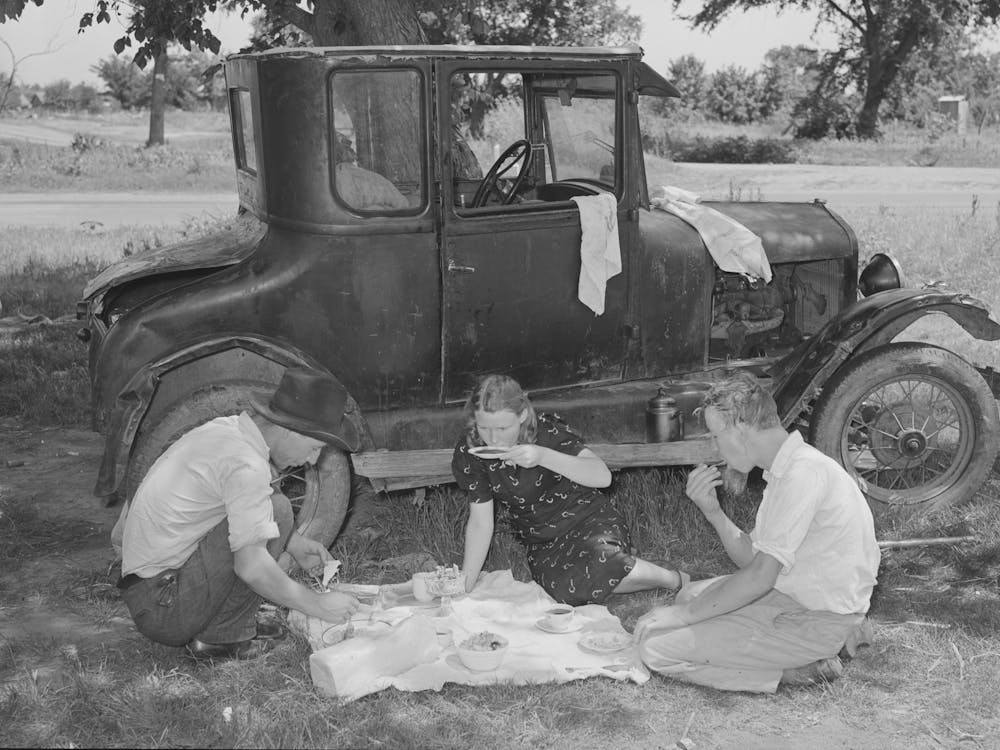 Migrant Workers Eating Dinner By The Side Of Their Car While They Are Camped Near Prague, Oklahoma, Lincoln Coun
