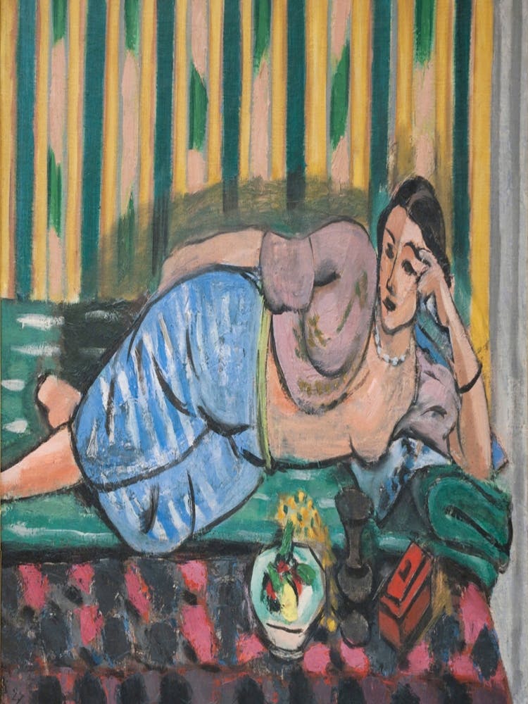 Woman Laying On A Bed