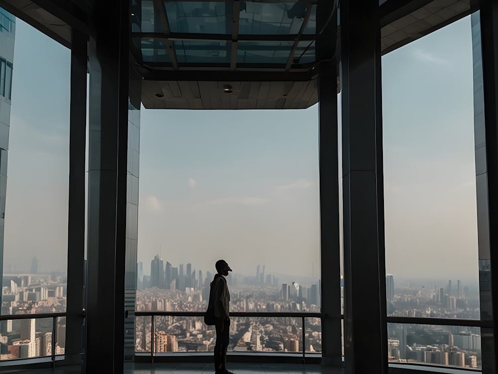 Man Looking Out Of A Window