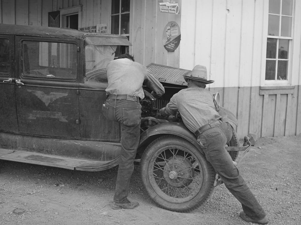 Garage Owner And Farmer Working On A Car, Pie Town, New Mexico, The Young Man Who Owns The Filling Station, Smit