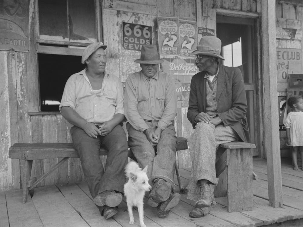 Men Talking On Porch Of Small Store Near Jeanerette, Louisiana By Russell Lee