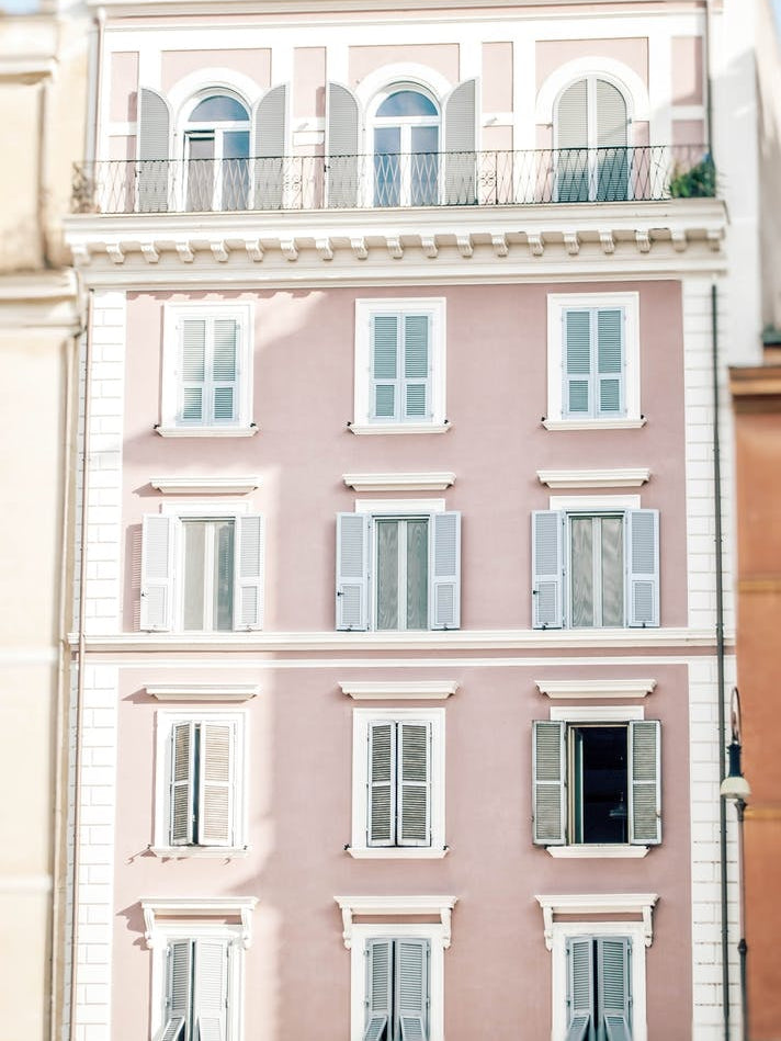 Pink Building In Rome with blue shutters