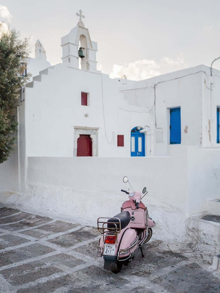 Pink Vespa In Front Of A Church