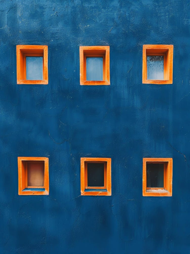 Blue Wall With Orange Windows