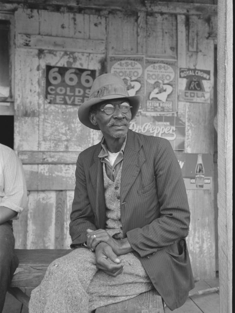 On Porch Of General Store Near Jeanerette, Louisiana By Russell Lee