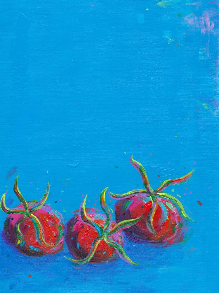Three Tomatoes On A Blue Background