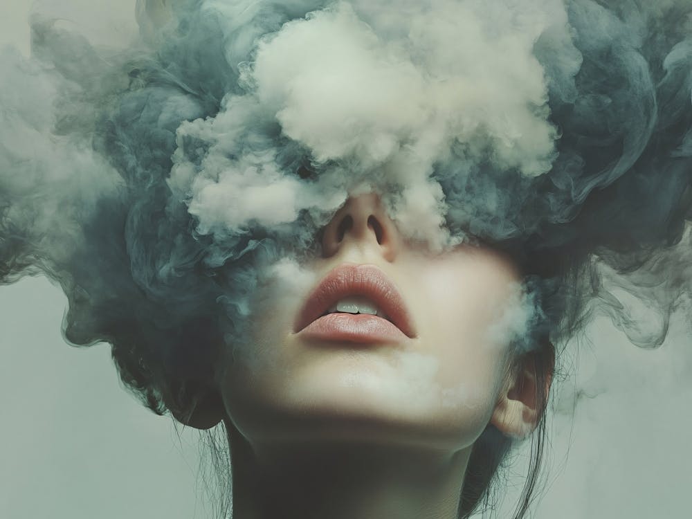 Smoke from Young Womens Face