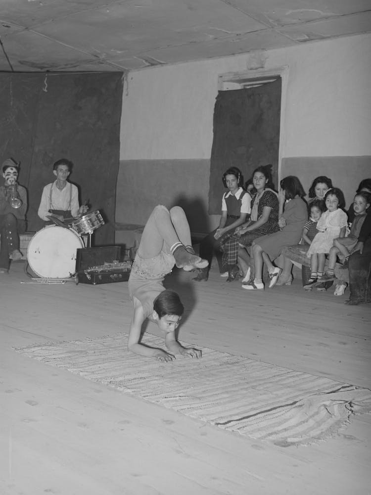 Acrobat And Audience At Spanish American Traveling Show, Penasco, New Mexico By Russell Lee