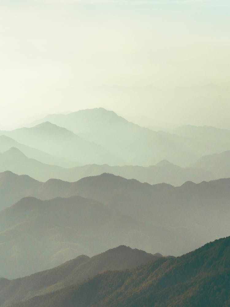 Misty Mountain Range at Sunrise