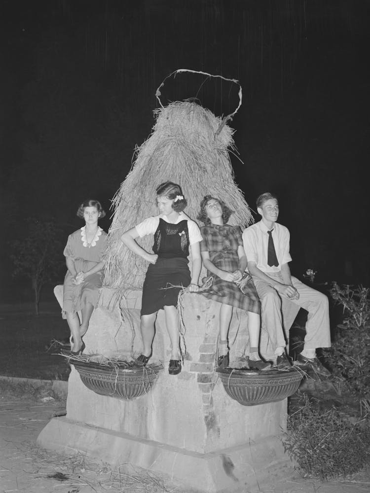 Sitting On Decorated Water Trough Watching The Night Parade At The National Rice Festival, Crowley