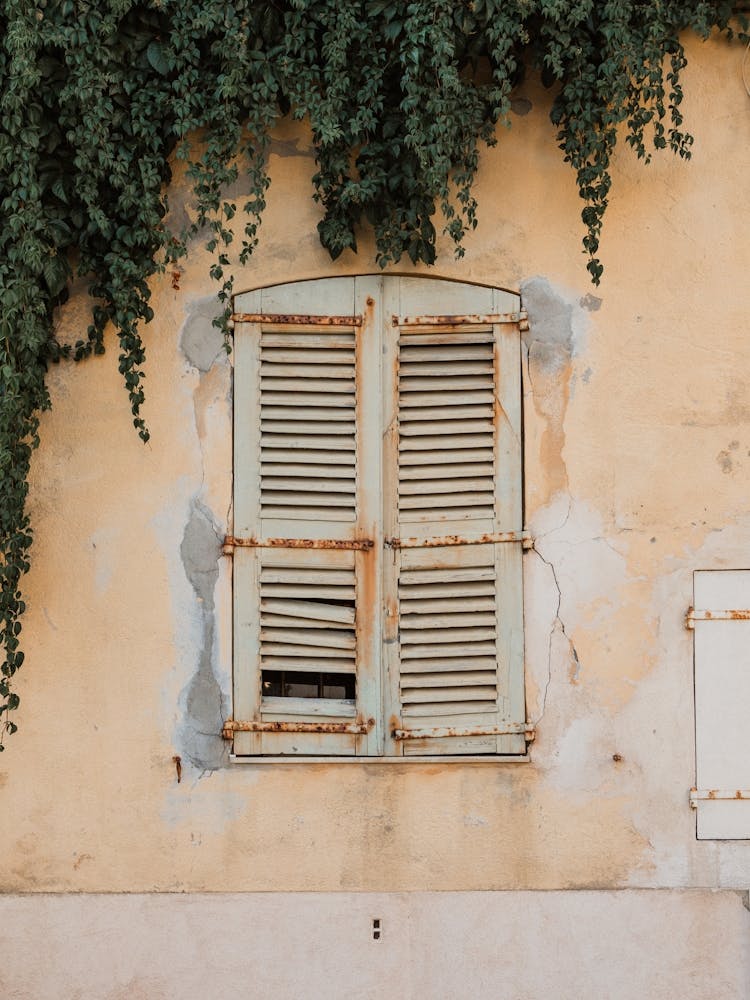 Shutters On A Yellow Wall France
