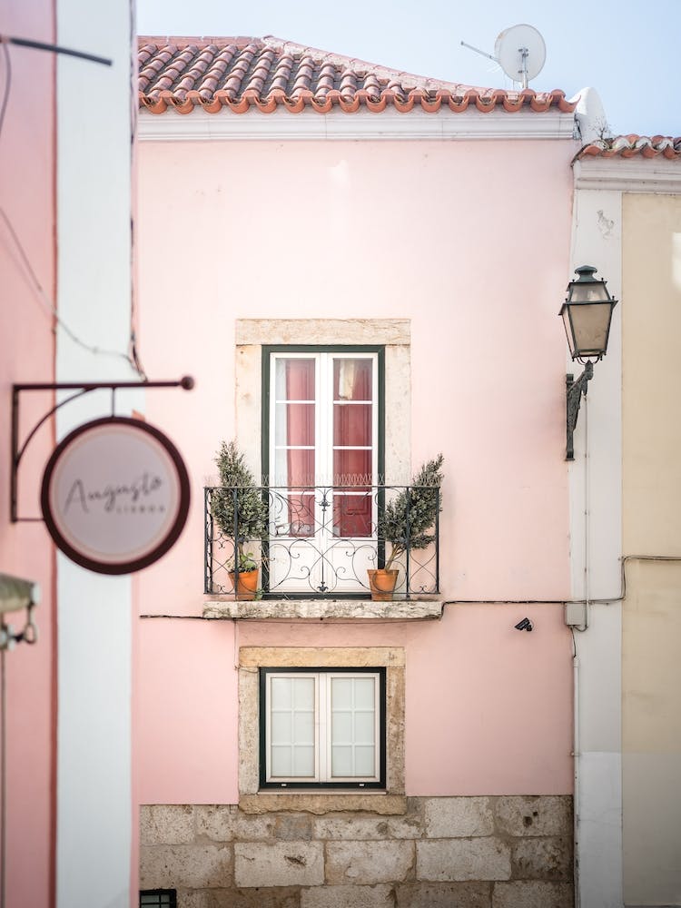 Pastel Pink House And Balcony At Alfama Lisbon