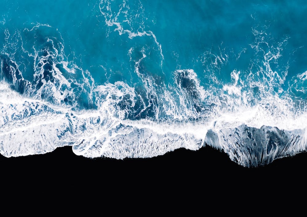 Black Sand Beach In Iceland With Waves 