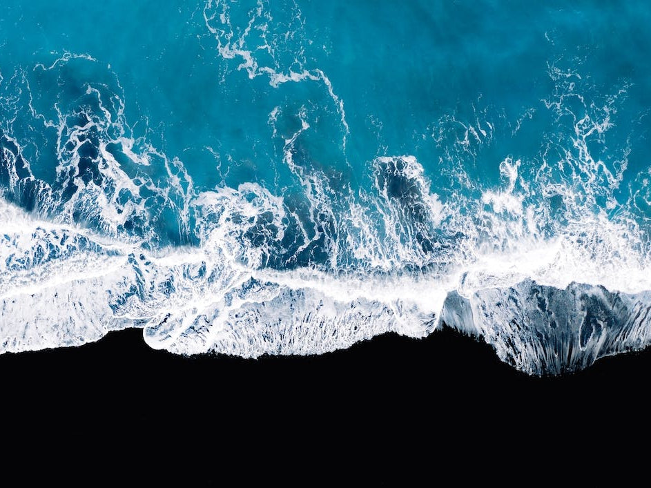 Black Sand Beach In Iceland With Waves 