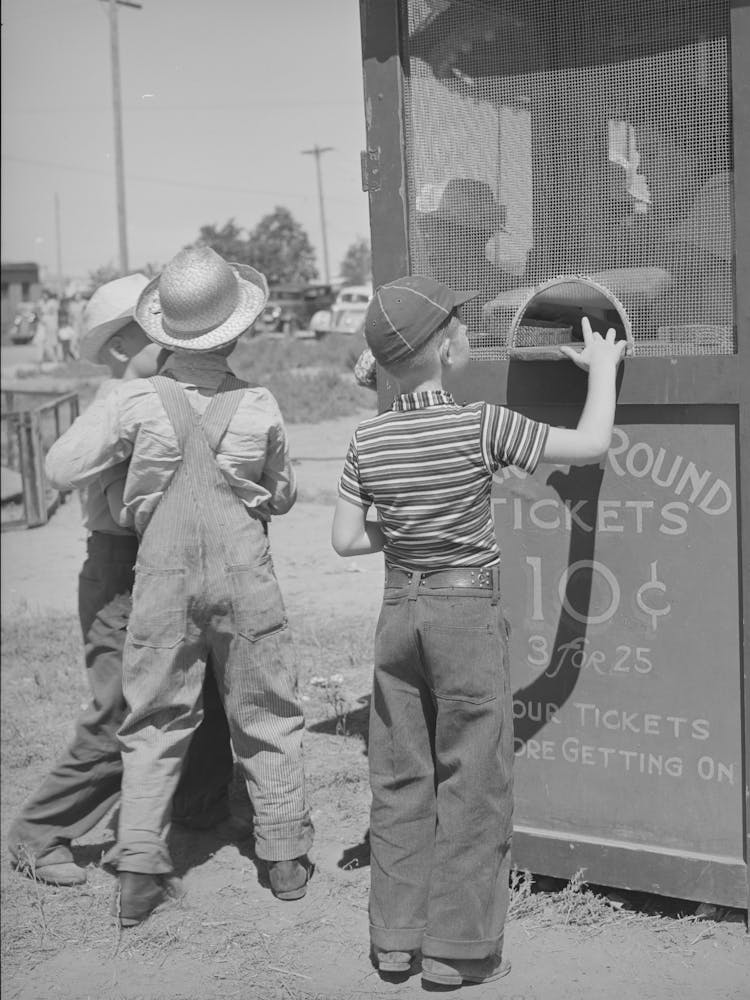 Farm Boys Buy Tickets For Ride At The Carnival On The Fourth Of July, Vale, Oregon By Russell Lee