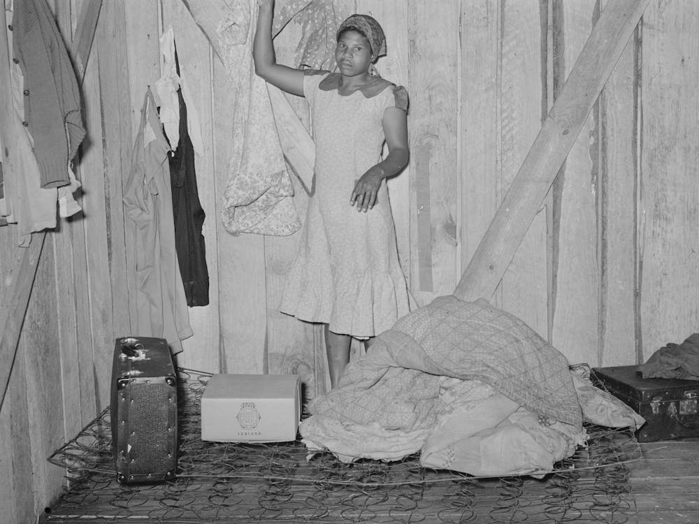 Woman, Strawberry Picker, Arranging Her Living Quarters Near Hammond, Louisiana By Russell Lee