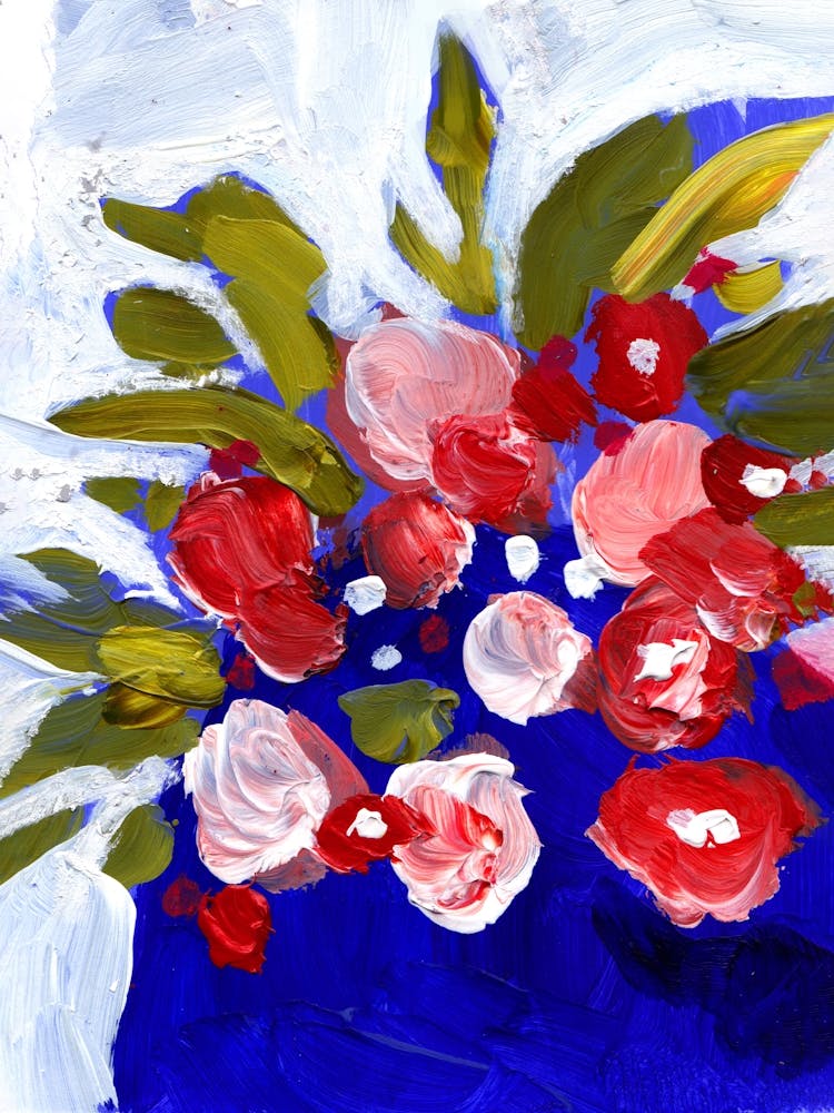 Bright red flowers in a blue vase