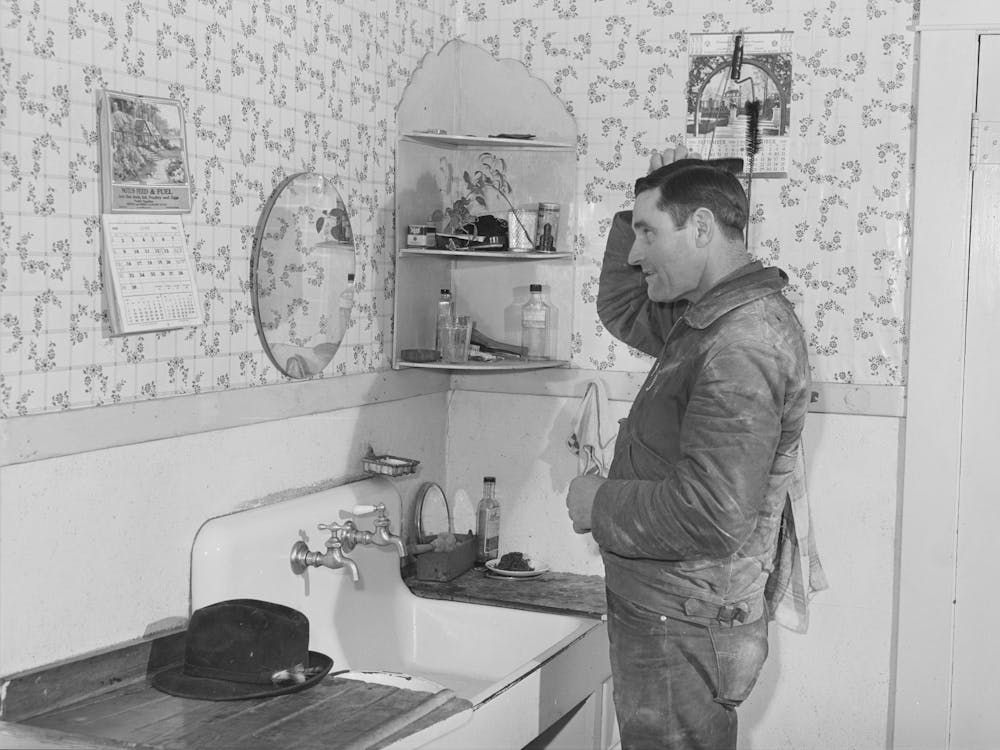 Lee Wagoner, Farmer On Black Canyon Project, Washes Up For Dinner, Canyon County, Idaho By Russell Lee