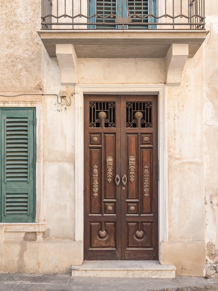 Door Of A Building With Shutters
