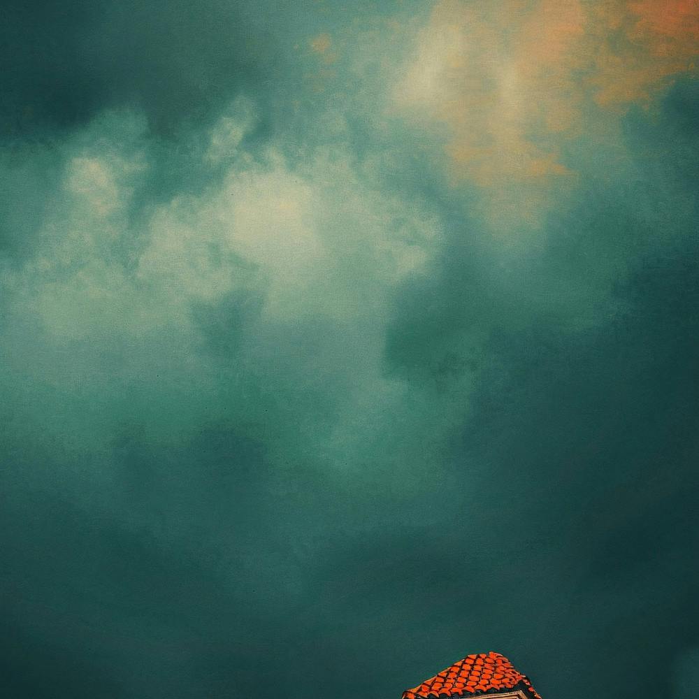House Under Stormy Sky