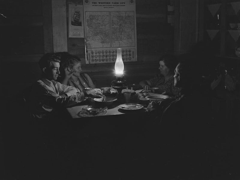 Farm Family After Evening Meal, Pie Town, New Mexico By Russell Lee