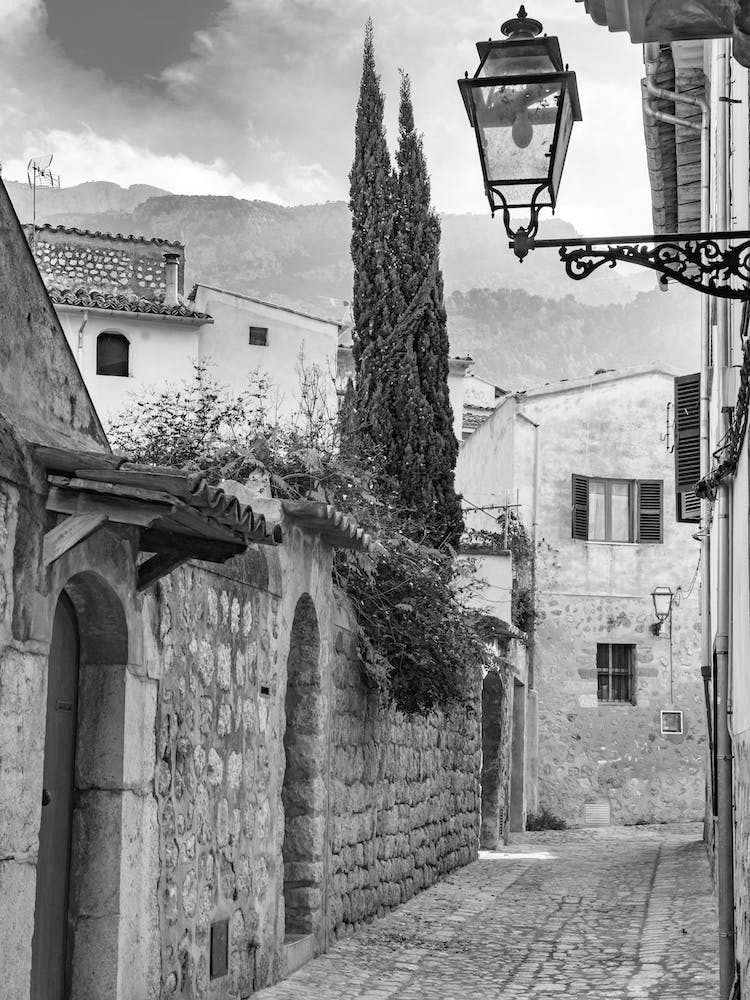 Narrow alley at Soller, old mediterranean town in Tramuntana mountains on Mallorca, Spain